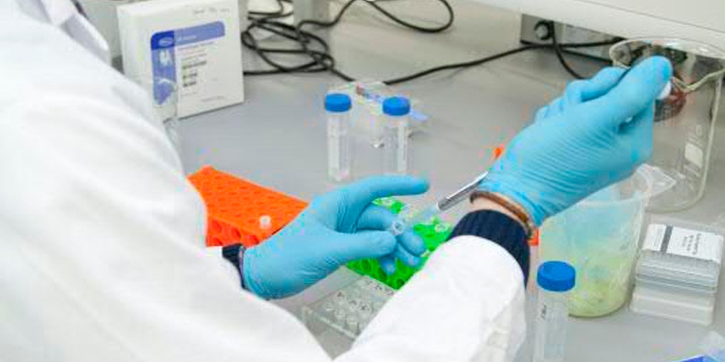 Taking process samples for analysis in the lab is expensive & not a real-time measurement. Food & beverage lab worker takes process manual grab samples for analysis in the plant's lab
